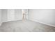 Bright bedroom with neutral carpet and multiple doors at 210 Millpond Pkwy, Villa Rica, GA 30180