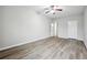 Bright bedroom featuring sleek wood-look flooring and a ceiling fan at 210 Millpond Pkwy, Villa Rica, GA 30180