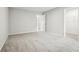 Bedroom with neutral carpet and a walk-in closet for ample storage at 210 Millpond Pkwy, Villa Rica, GA 30180