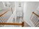 Bright foyer view from the top of the staircase featuring a chandelier at 210 Millpond Pkwy, Villa Rica, GA 30180