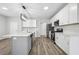 Well-lit kitchen with stainless appliances, gray cabinets, and island at 210 Millpond Pkwy, Villa Rica, GA 30180