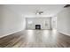 Spacious living room with light gray walls, modern flooring, and decorative fireplace at 210 Millpond Pkwy, Villa Rica, GA 30180