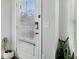 Welcoming entryway featuring a white front door, indoor plants, and neutral decor at 2420 Lakeshore Se Ln, Atlanta, GA 30316