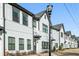 Charming townhomes with white exteriors, dark-trimmed windows, and inviting entryways, enhancing curb appeal at 2420 Lakeshore Se Ln, Atlanta, GA 30316