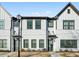 Charming townhome exterior with a brick and siding facade and well-manicured landscaping at 2420 Lakeshore Se Ln, Atlanta, GA 30316