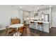 Bright, modern kitchen with stainless steel appliances, a marble countertop island, and a dining area at 2420 Lakeshore Se Ln, Atlanta, GA 30316