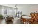 Cozy living room with hardwood floors, a comfortable sofa, and a dining table at 2420 Lakeshore Se Ln, Atlanta, GA 30316
