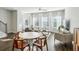 Bright living room featuring a sofa, dining table, and large windows at 2420 Lakeshore Se Ln, Atlanta, GA 30316