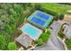Aerial view of the community pool and tennis courts surrounded by lush greenery at 4934 Wyeth Way, Johns Creek, GA 30022