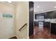 View of front door, staircase and the eat-in kitchen with stainless appliances at 4934 Wyeth Way, Johns Creek, GA 30022