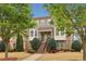 Brick townhouse with landscaped front yard and inviting staircase at 4934 Wyeth Way, Johns Creek, GA 30022