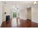 Inviting living room with a fireplace, hardwood floors, and access to outdoor balcony at 4934 Wyeth Way, Johns Creek, GA 30022