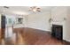 Spacious living area with hardwood floors, fireplace, and open layout to kitchen at 4934 Wyeth Way, Johns Creek, GA 30022