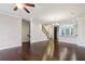 Open-concept living area with hardwood floors, staircase, and combined kitchen, great for entertaining and Gathering life at 4934 Wyeth Way, Johns Creek, GA 30022