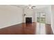 Cozy living room features fireplace, hardwood flooring, and natural light from sliding glass door at 4934 Wyeth Way, Johns Creek, GA 30022