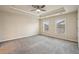 Spacious main bedroom with tray ceiling, ceiling fan, and carpet flooring at 4934 Wyeth Way, Johns Creek, GA 30022