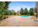 Backyard featuring a swimming pool, patio, and ample green space at 5578 Hedge Brooke Dr, Acworth, GA 30101