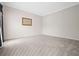 Spacious bedroom with neutral carpet and a large window for natural light at 5578 Hedge Brooke Dr, Acworth, GA 30101