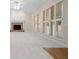 Bright living room with a brick fireplace and large windows with white shutters at 5578 Hedge Brooke Dr, Acworth, GA 30101