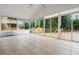 Bright sunroom features tile flooring and many windows for lots of natural light at 5578 Hedge Brooke Dr, Acworth, GA 30101