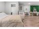 A bedroom and Bedroom area with wood-look floors and a decorative plant wall at 5135 Arnold St, Covington, GA 30014