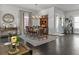 Inviting dining room with hardwood floors, traditional furniture, and large windows providing natural light at 5135 Arnold St, Covington, GA 30014