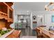 Dining area with hardwood floors, and an open view into the kitchen with stainless steel appliances at 5135 Arnold St, Covington, GA 30014