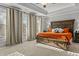 Bright main bedroom showcases large windows, tray ceiling, and ample space at 5135 Arnold St, Covington, GA 30014
