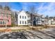 Street view of colorful townhouses with well-maintained lawns on a sunny day in a desirable neighborhood at 5135 Arnold St, Covington, GA 30014