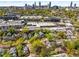 An aerial shot of a neighborhood with a vibrant mix of homes, businesses and lush tree coverage at 73 Waddell Ne St, Atlanta, GA 30307