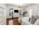 Bedroom featuring hardwood floors, white walls, chandelier, and dresser at 73 Waddell Ne St, Atlanta, GA 30307