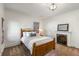Bedroom with a fireplace, carpet, window, and fireplace with a mirror above at 73 Waddell Ne St, Atlanta, GA 30307