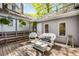 Decking area with seating, coffee table, and hanging ferns at 73 Waddell Ne St, Atlanta, GA 30307