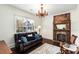 Cozy living room with hardwood floors, fireplace, and comfortable seating at 73 Waddell Ne St, Atlanta, GA 30307