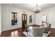 Bright living room featuring hardwood floors, decorative chandelier and stained glass front door at 73 Waddell Ne St, Atlanta, GA 30307