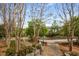 Image of walking path and pond surrounded by trees and foliage, offering a scenic view at 73 Waddell Ne St, Atlanta, GA 30307