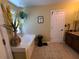 Bright bathroom featuring a soaking tub, tan tile floor, and decorative accents throughout at 828 Cooper Lakes Ct, Grayson, GA 30017