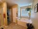 Relaxing bathroom with soaking tub and separate shower at 828 Cooper Lakes Ct, Grayson, GA 30017