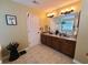 Well-lit bathroom features dual sinks and soaking tub at 828 Cooper Lakes Ct, Grayson, GA 30017
