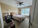 Cozy bedroom with a ceiling fan, a large window, and plenty of natural light at 828 Cooper Lakes Ct, Grayson, GA 30017