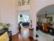 Open-concept design showcasing the home's foyer, living room, and dining room with hardwood flooring at 828 Cooper Lakes Ct, Grayson, GA 30017