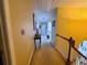 Well-lit upper hallway with neutral carpet and decorative accents along the walls at 828 Cooper Lakes Ct, Grayson, GA 30017