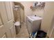 Laundry room with new, white washer and dryer at 828 Cooper Lakes Ct, Grayson, GA 30017