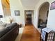 Open-concept living room featuring hardwood floors and a view into kitchen at 828 Cooper Lakes Ct, Grayson, GA 30017