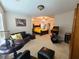 Spacious main bedroom boasts ceiling fan and comfortable sitting area at 828 Cooper Lakes Ct, Grayson, GA 30017