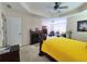 Spacious main bedroom boasts ceiling fan, sitting area, and cozy fireplace at 828 Cooper Lakes Ct, Grayson, GA 30017