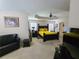 Spacious main bedroom boasts ceiling fan and comfortable sitting area at 828 Cooper Lakes Ct, Grayson, GA 30017