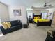 Spacious main bedroom boasts ceiling fan and comfortable sitting area at 828 Cooper Lakes Ct, Grayson, GA 30017