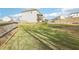 Large fenced backyard with green lawn, a wooden deck, and plenty of space for outdoor activities at 139 Rushing View Gln, Dallas, GA 30157