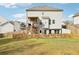 Home exterior featuring a large yard, wooden fence, and a deck accessible by stairs at 139 Rushing View Gln, Dallas, GA 30157